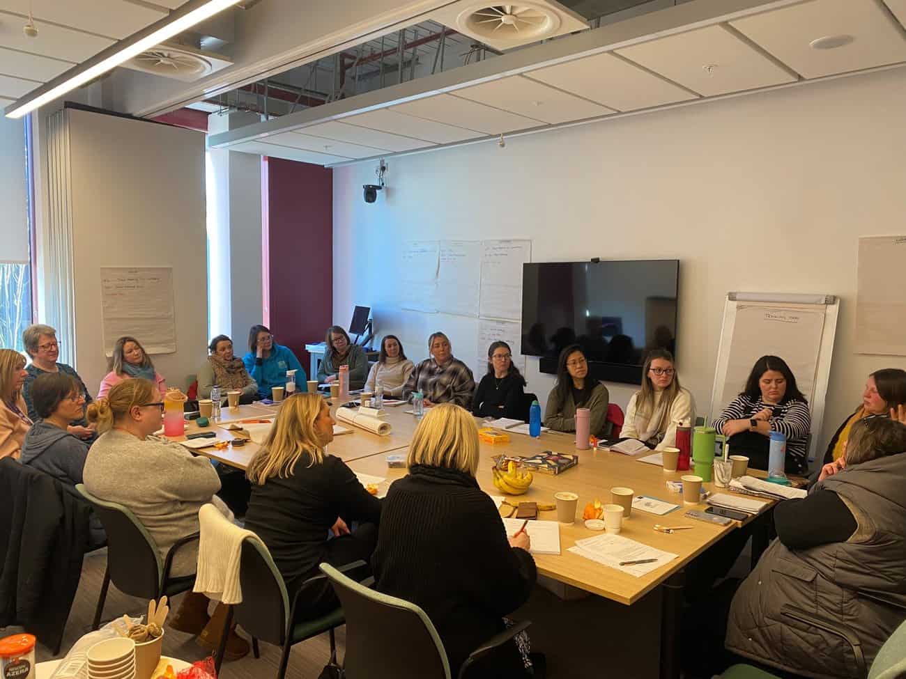 Image of the Home-Start Team at a meeting.