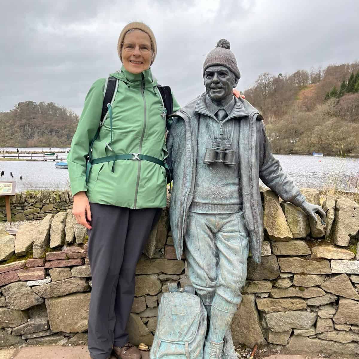 Image of Home-Start Volunteer Marilyn standing with a statue whilst completing the West Highland Way