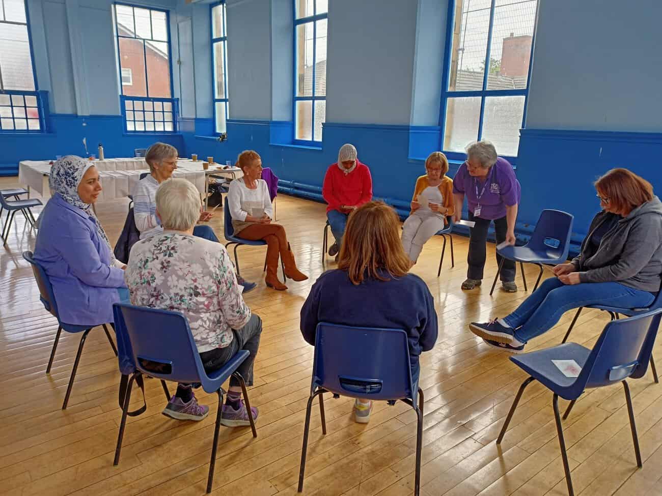 Image of Home-Start Volunteers and Staff sitting in a circle