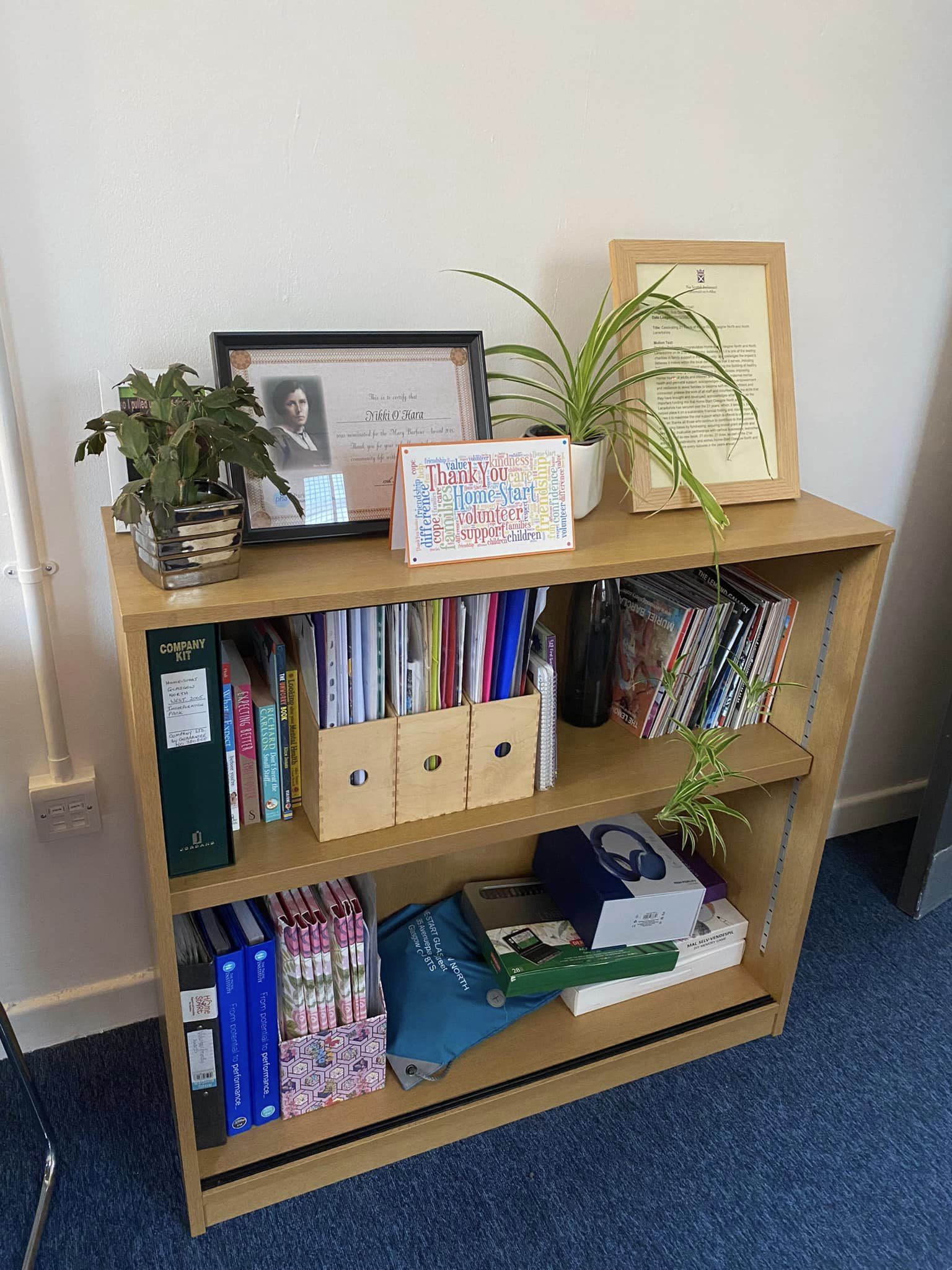 Image of bookcase within the new Home-Start office.