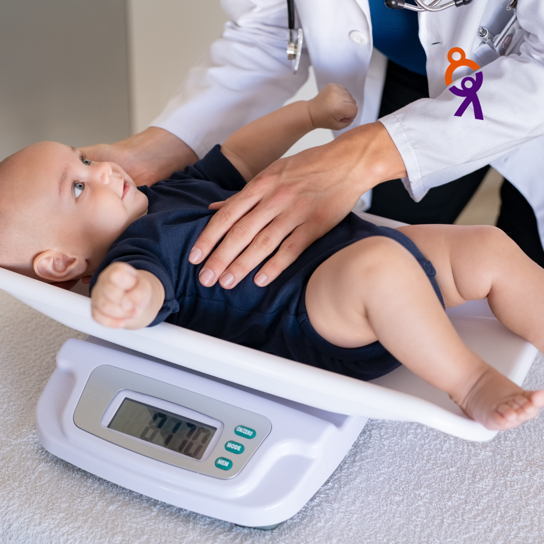 Image of baby being weighed on scales.