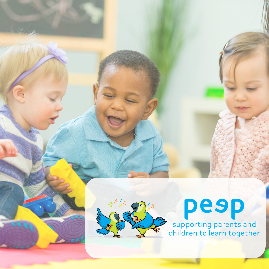 Image of babies on the floor with colourful blocks