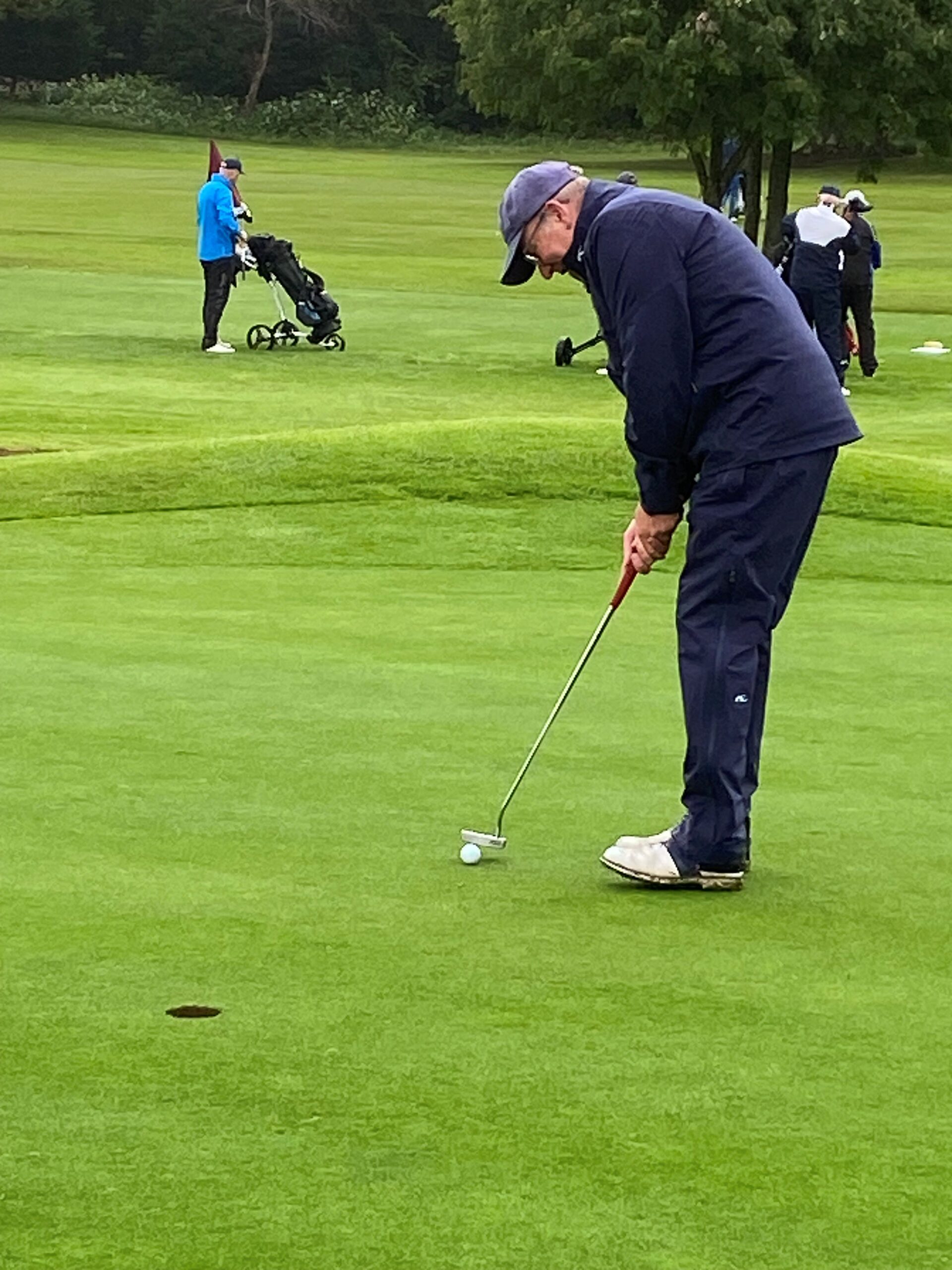 Image of a golfer playing golf 