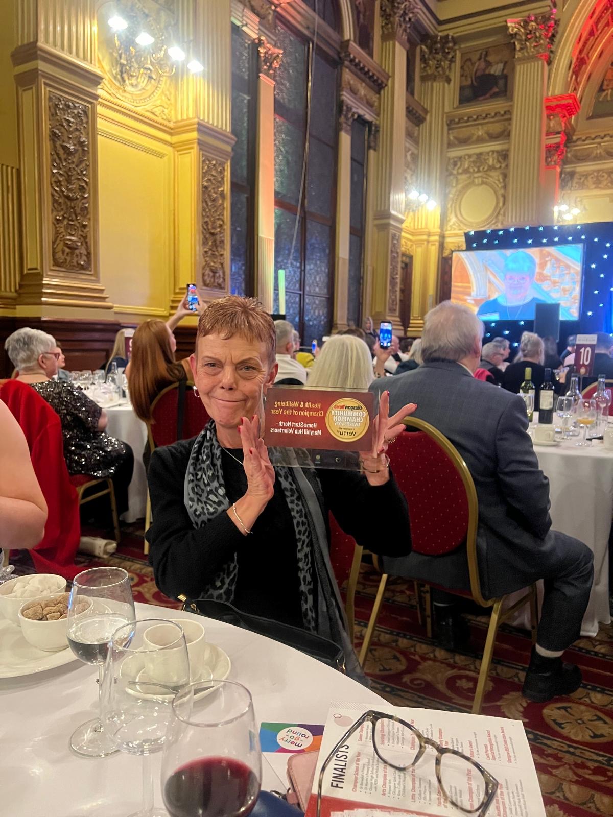 Image of Home-Start Volunteer Karen with her award.