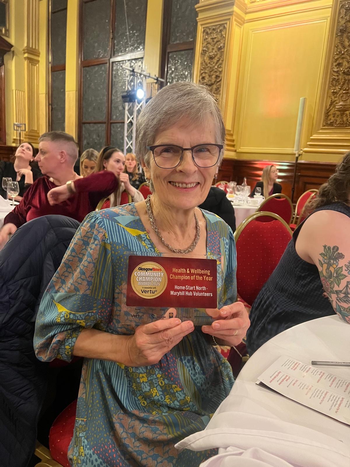 Image of Home-Start Volunteer Marilyn with her award.